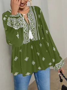 Retro green folk style blouse with lantern sleeves and white tassel neck tie detail