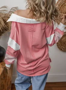 Back detail of a pink color-block sweatshirt with striped sleeves and loose fit design.