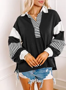 Detail shot of the stylish V-neck and striped color-block paneling on a casual oversized sweatshirt.