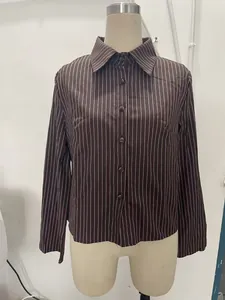 A professional front view of a brown vertical striped long-sleeve shirt on a mannequin