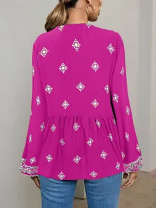 Back view of a fuchsia ethnic boho blouse featuring intricate white diamond patterns