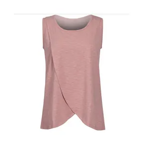 Close-up front detail of a pink sleeveless nursing top with cross-over maternity design