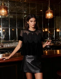 Elegant black velvet short-sleeve top featuring intricate mesh lace embroidery detailing