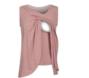 Detailed macro view of pink sleeveless maternity nursing tank top with twist opening