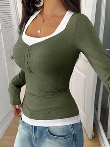 Detail view of olive green mock two-piece long sleeve top with buttons