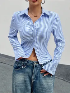 Fashionable blue and white vertical striped long sleeve button-up shirt worn by model
