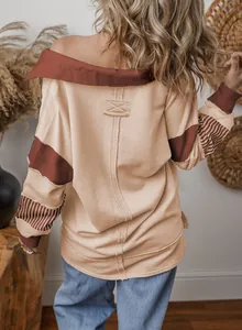 Detailed back view of a casual loose colorblock sweatshirt with striped sleeve accents