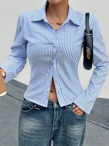 Detailed view of a trendy vertical blue and white striped long sleeve shirt for women