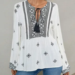 Retro bohemian white blouse with black geometric embroidery, tassel ties and lantern sleeves