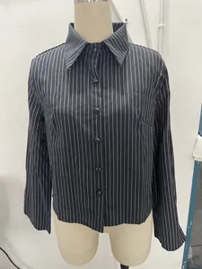 Front view of a classic black and white pinstriped button-down shirt on mannequin