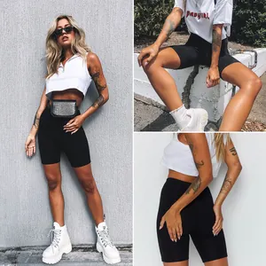 Detailed view of high-waist black yoga biker shorts for women in a lifestyle setting