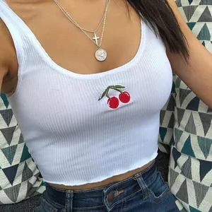 Tight white ribbed crop tank top with detailed red cherry embroidery on the chest