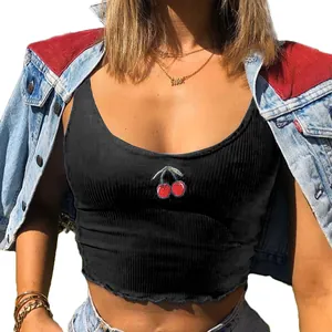 Detailed view of black ribbed crop top featuring red cherry embroidery on the chest.