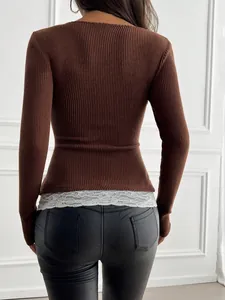 Back view of slim brown ribbed long-sleeve top with elegant white lace hem detail.