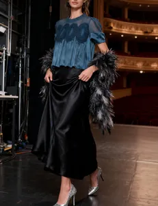 Elegant teal mesh top featuring intricate floral lace embroidery and sheer sleeves