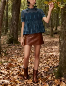 Fashionable velvet loose top with mesh embroidery and lace trim in forest setting