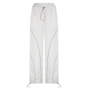 Front view detail of trendy high-waisted white wide-leg trousers with toggle drawstring.
