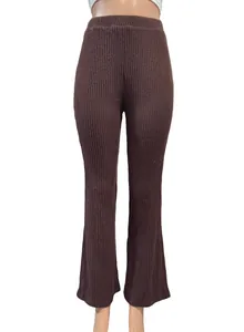 Women's brown ribbed knit flare pants with elastic waist shown in detail on mannequin