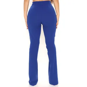 Back view of elegant blue high-waisted flared trousers showing a slim fit design