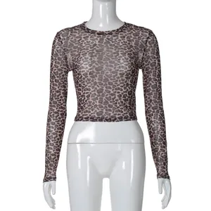Front view of a sexy leopard print mesh long sleeve crop top on a white mannequin