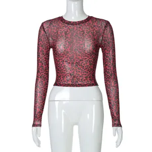 Close-up detail of sexy red leopard print mesh top with long sleeves and round neck design