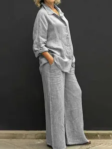 Set casual due pezzi in lino grigio con camicia a rever e pantaloni a gamba larga