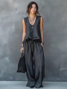 Macro view of charcoal grey linen sleeveless ruffle top and matching wide-leg pants