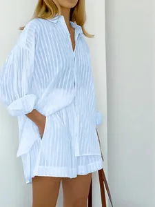 Detail view of light blue striped puff sleeve shirt and matching shorts set