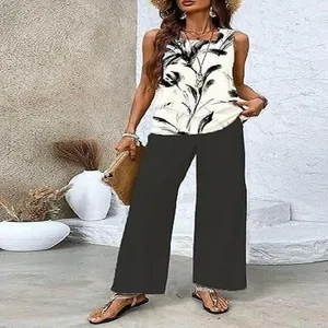 Elegant sleeveless casual set featuring a palm leaf print top and black wide-leg trousers