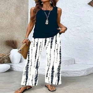 Casual summer two-piece set featuring navy sleeveless top and tie-dye wide-leg pants