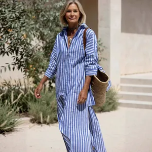 Elegant blue and white vertical striped shirt dress with long sleeves and side slits
