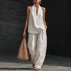 White sleeveless halter top and wide-leg trousers linen-style two-piece summer set