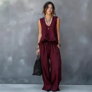 Elegant wine red two-piece set with sleeveless ruffle top and loose wide-leg pants