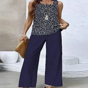 Polka dot sleeveless top paired with navy blue wide-leg pants on a female model.
