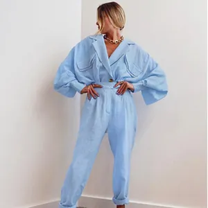 Elegant women's light blue two-piece set with loose long-sleeve shirt and trousers