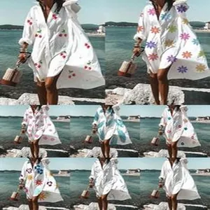 Detailed view showing eight different colorful print options for the oversized white shirt dress.