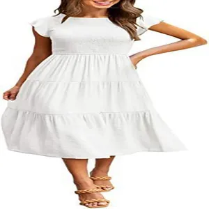 Close-up of white tiered maxi dress with flutter sleeves and smocked waist
