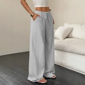 Casual grey textured wide-leg trousers for women with drawstring waist and pockets
