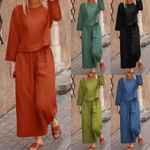 Detail view of women's long-sleeve two-piece set with wide-leg pants in multiple colors