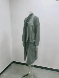 Detailed side view of a stylish women's gray long casual open-front warm coat