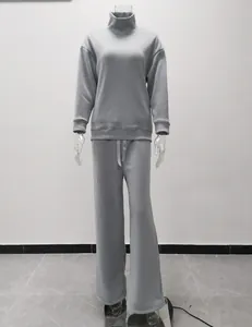 Two-piece casual set featuring a grey high-neck sweatshirt and matching wide-leg pants