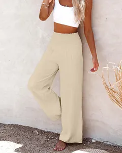 Chic women's beige wide-leg cotton pants featuring a stylish smocked waistband detail.