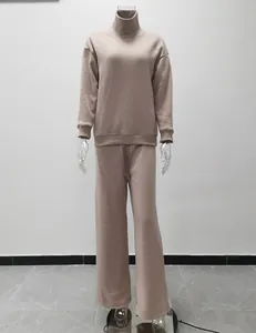 Full view of a stylish beige high-neck sweatshirt and wide-leg pants set for women