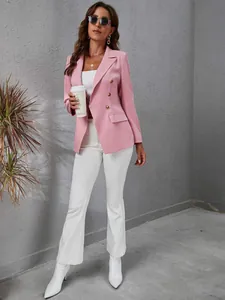 Elegant pink slim fit double-breasted blazer for women in urban street style setting