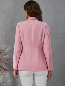 Back view of a slim fit pink blazer for women featuring an elegant tailored waistline.