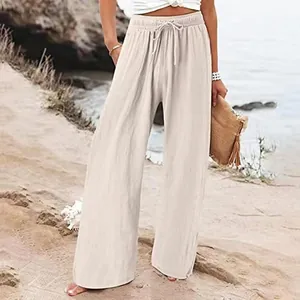 Pantalon taille haute en lin et coton à jambes larges pour femmes en bord de mer