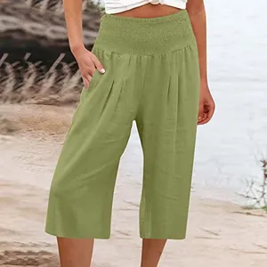 Pantaloni culotte verde oliva a vita alta con fascia arricciata per donna in estate.