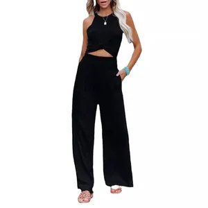 Stylish summer women's black sleeveless tie-front top and wide-leg trousers casual set