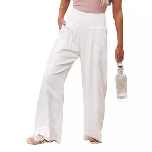Elegant casual white cotton wide-leg trousers for women featuring a high smocked waist