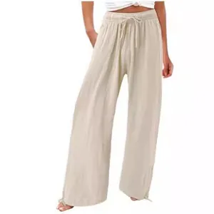 Pantalon large en lin de coton beige à taille haute pour femme mode de plage